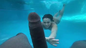 Uninhibited teen engages in underwater encounter with well-endowed black partner