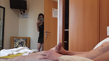 Motel room encounter turns into a handjob from a surprising maid